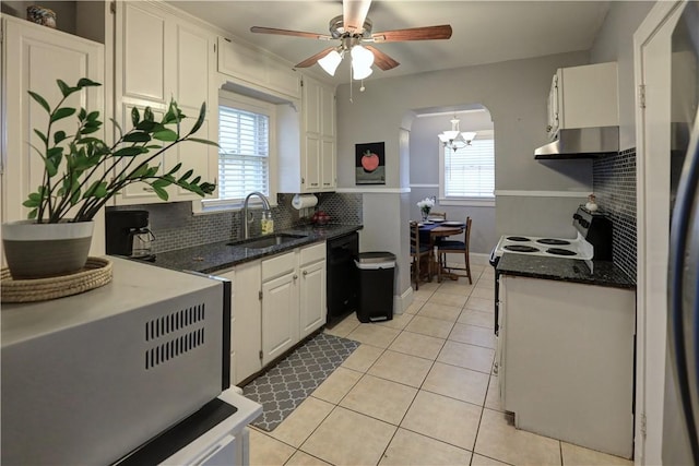 501 Del Mar Blvd, Corpus Christi, TX 78404 - kitchen featuring extractor fan, a sink, backsplash, and plenty of natural light