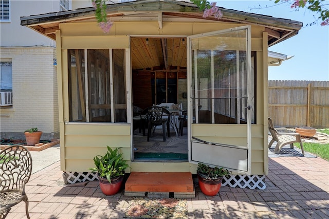 view of patio with a sunroom