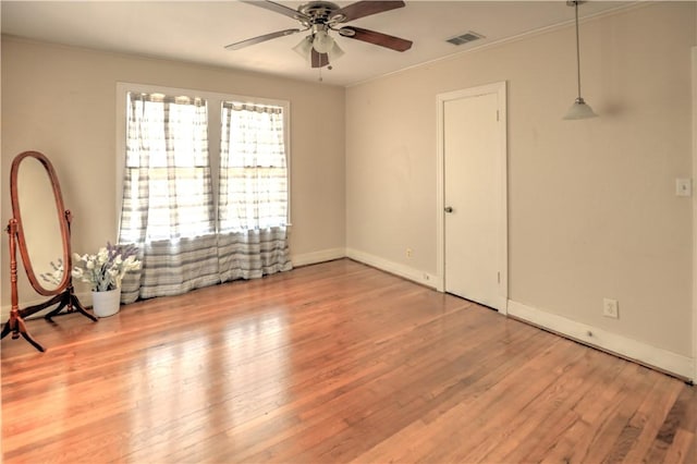 501 Del Mar Blvd, Corpus Christi, TX 78404 - unfurnished room featuring a ceiling fan, wood finished floors, crown molding, and baseboards