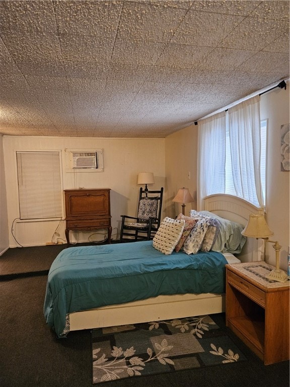 bedroom with carpet and a wall mounted air conditioner