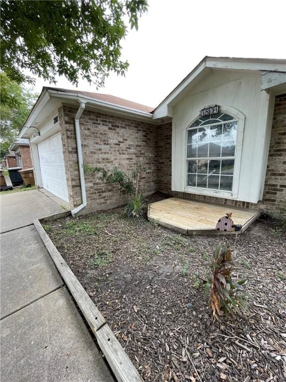 view of property exterior featuring a garage