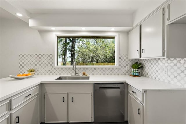 11029 Stonewall Blvd, Corpus Christi, TX 78410 - kitchen with stainless steel dishwasher, light countertops, tasteful backsplash, and recessed lighting