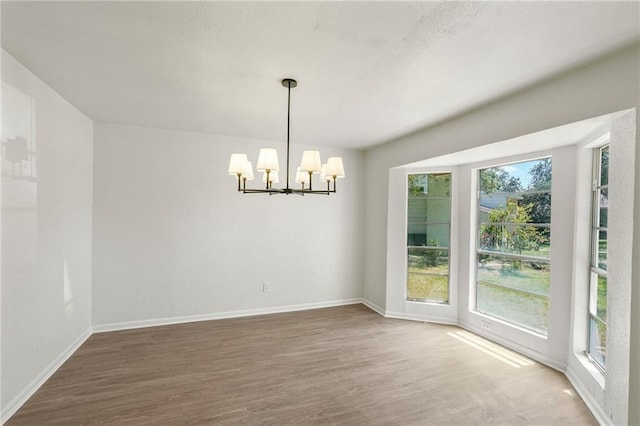 11029 Stonewall Blvd, Corpus Christi, TX 78410 - unfurnished room featuring a chandelier and wood finished floors