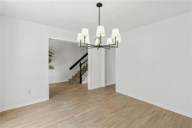 11029 Stonewall Blvd, Corpus Christi, TX 78410 - unfurnished room featuring a chandelier, light wood-style floors, and stairs