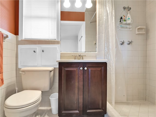 bathroom featuring toilet, tile walls, vanity, and curtained shower