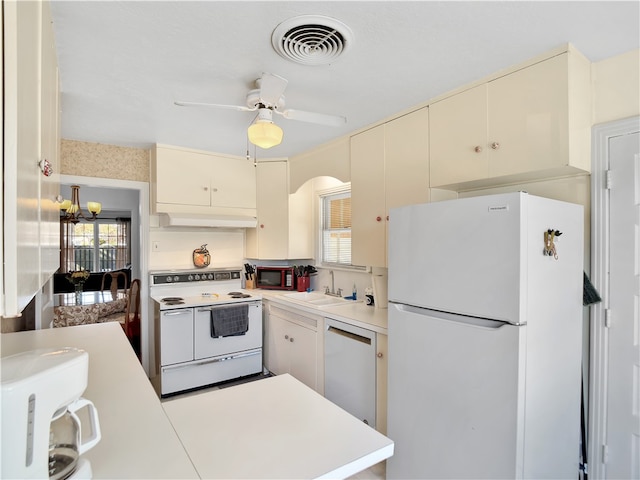 kitchen featuring ceiling fan, sink, white appliances, and cream cabinets