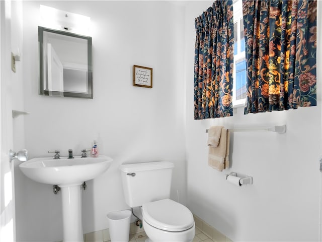 bathroom featuring toilet and tile patterned floors