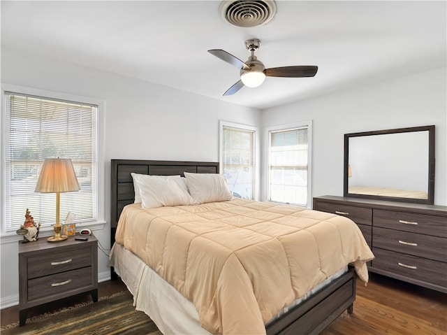 bedroom featuring ceiling fan and dark wood-type flooring