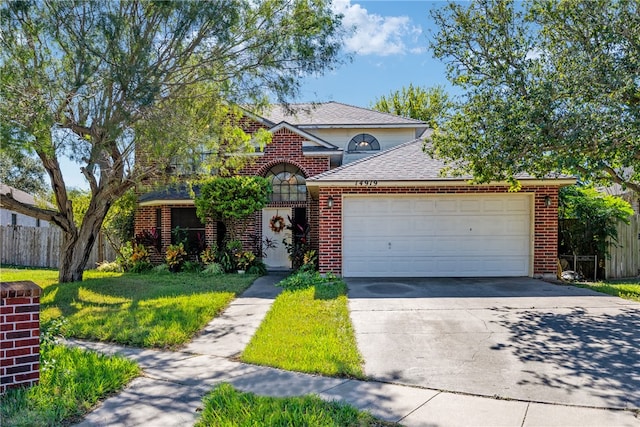 front facade featuring a front lawn and a garage