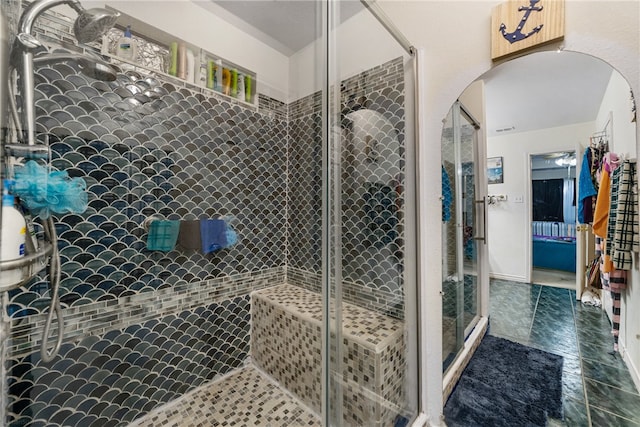 bathroom with a shower with shower door