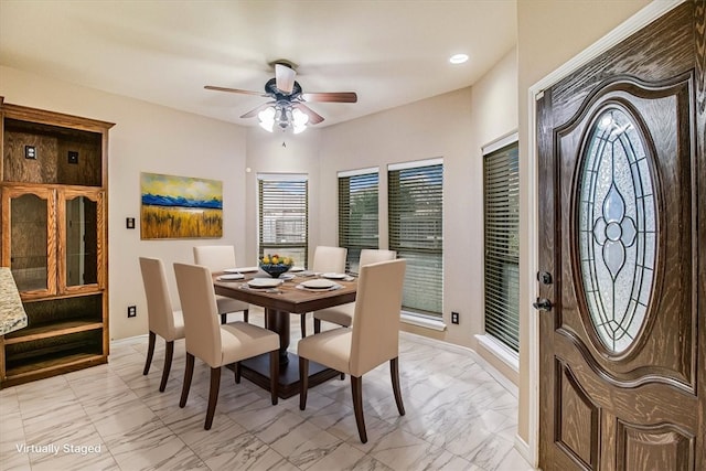 dining space with ceiling fan