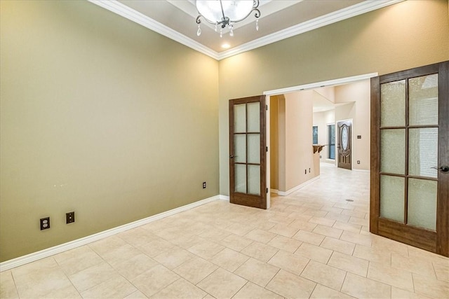 tiled empty room with ornamental molding, french doors, and a chandelier