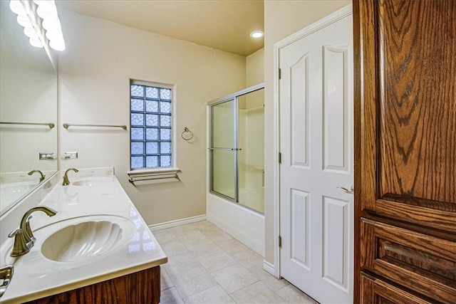 bathroom with vanity, tile patterned floors, and shower / bath combination with glass door