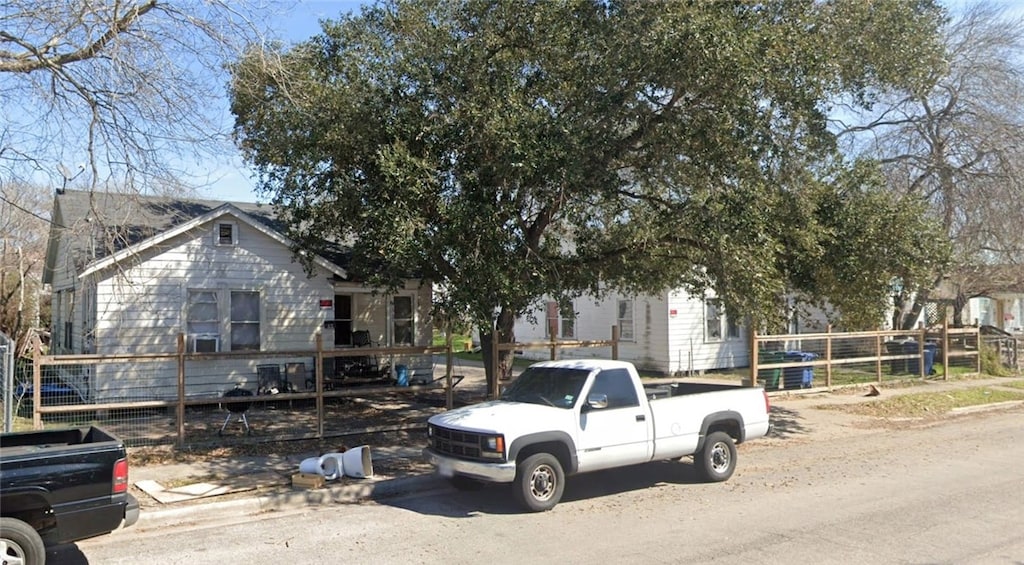 view of property hidden behind natural elements