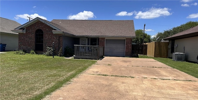 2993 Todd Cir, Ingleside, TX 78362 - single story home with brick siding, driveway, a garage, central AC, and a shingled roof