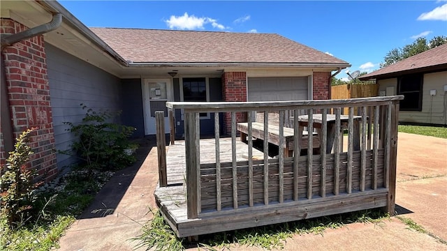 2993 Todd Cir, Ingleside, TX 78362 - wooden terrace with an attached garage and fence