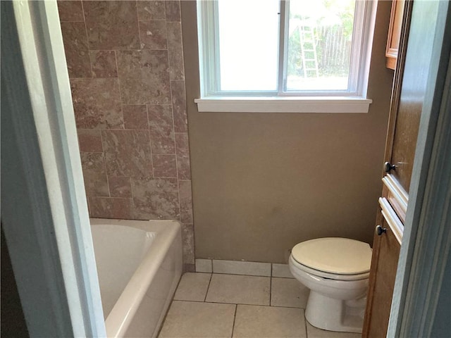 full bath with baseboards, tile patterned flooring, and toilet