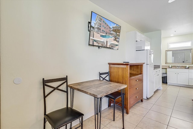 dining space with light tile patterned floors