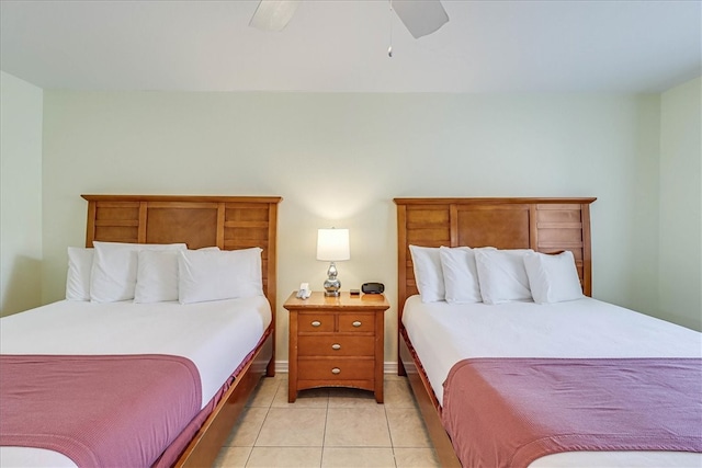 tiled bedroom with ceiling fan