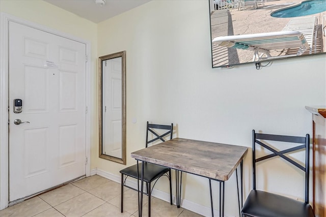 dining area featuring light tile patterned floors