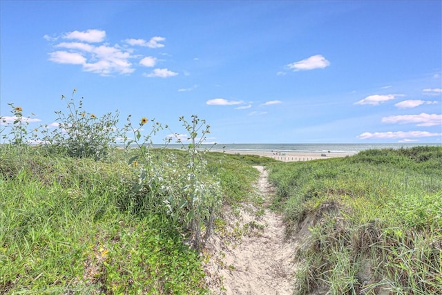 view of landscape with a view of the beach and a water view