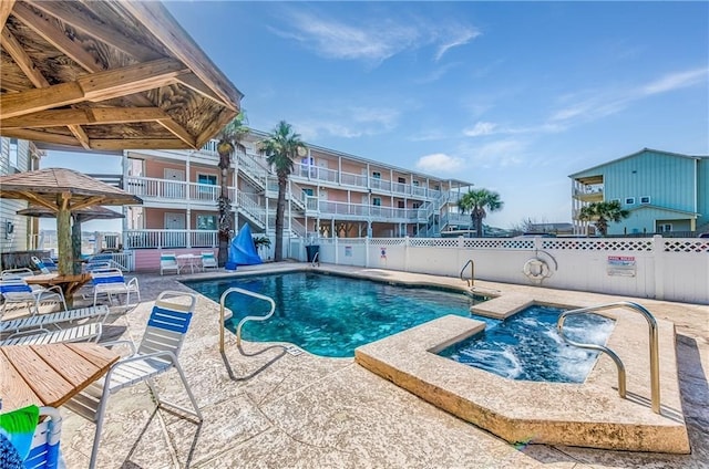 view of swimming pool with a patio area