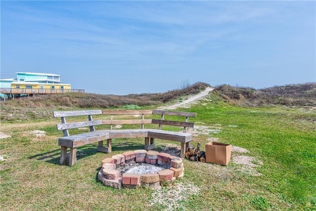 view of yard with a fire pit