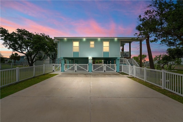 42 Nassau Dr, Rockport, TX 78382 - view of front of home featuring driveway, a gate, and a carport