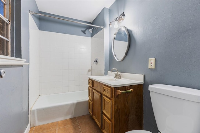 1206 Hibiscus St, Corpus Christi, TX 78405 - bathroom featuring vanity, tile patterned flooring, toilet, and bathing tub / shower combination