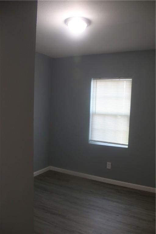 spare room featuring dark hardwood / wood-style floors