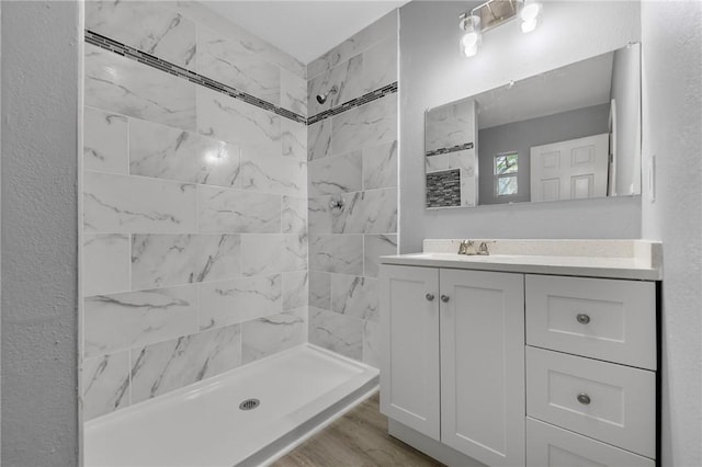 314 Old Robstown, Corpus Christi, TX 78408 - full bath with tiled shower, vanity, and wood finished floors