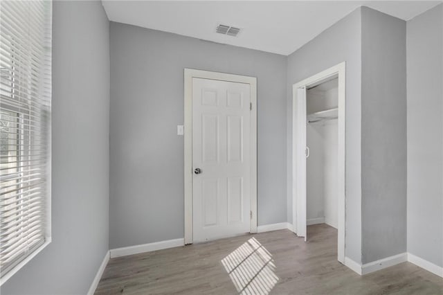 314 Old Robstown, Corpus Christi, TX 78408 - unfurnished bedroom featuring wood finished floors, baseboards, and a closet