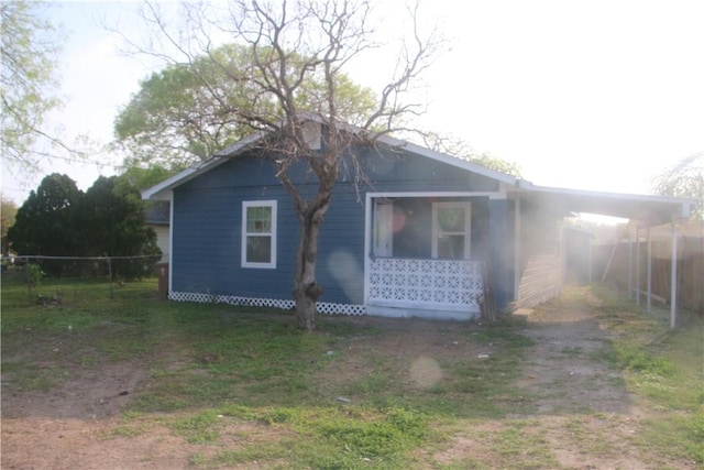 exterior space featuring a carport