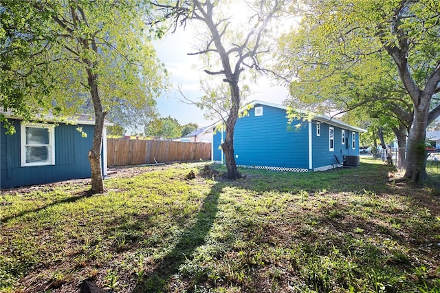 view of yard featuring central air condition unit