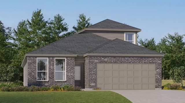 view of front facade with a garage and a front lawn