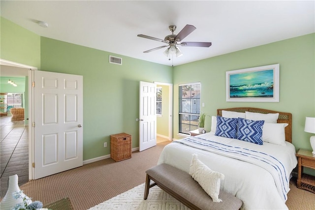 carpeted bedroom featuring ceiling fan