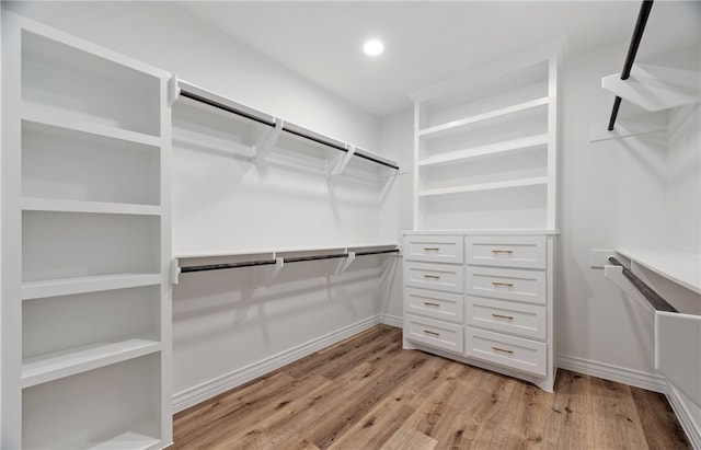 walk in closet featuring light wood-style flooring