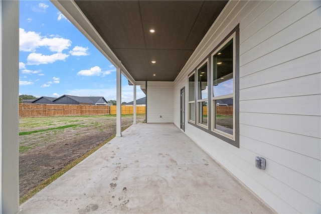 view of patio / terrace featuring fence