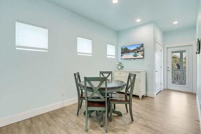 835 Ocean Side Dr, Port Aransas, TX 78373 - dining room with plenty of natural light, baseboards, light wood-style floors, and recessed lighting