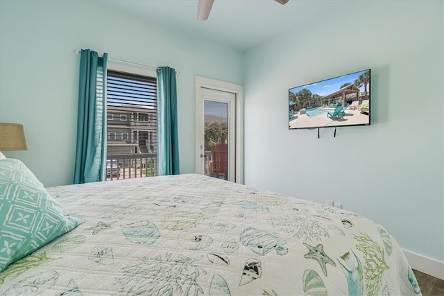 835 Ocean Side Dr, Port Aransas, TX 78373 - bedroom featuring access to outside, a ceiling fan, baseboards, and wood finished floors