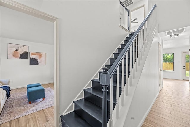 5025 Queens Ct, Corpus Christi, TX 78413 - staircase with wood finished floors and baseboards