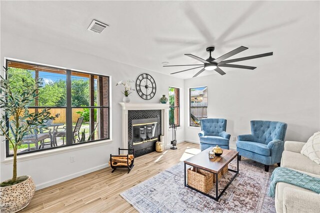 5025 Queens Ct, Corpus Christi, TX 78413 - living room with a ceiling fan, wood finished floors, and a tile fireplace