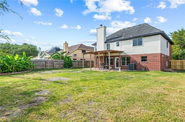 5025 Queens Ct, Corpus Christi, TX 78413 - back of house featuring brick siding, a patio, a fenced backyard, and a chimney