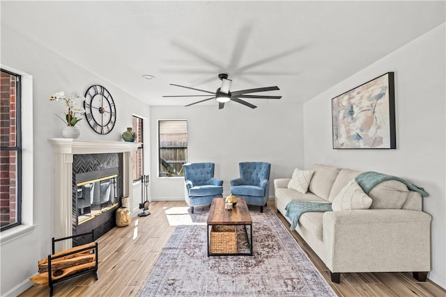 5025 Queens Ct, Corpus Christi, TX 78413 - living room featuring wood finished floors, a ceiling fan, and a fireplace