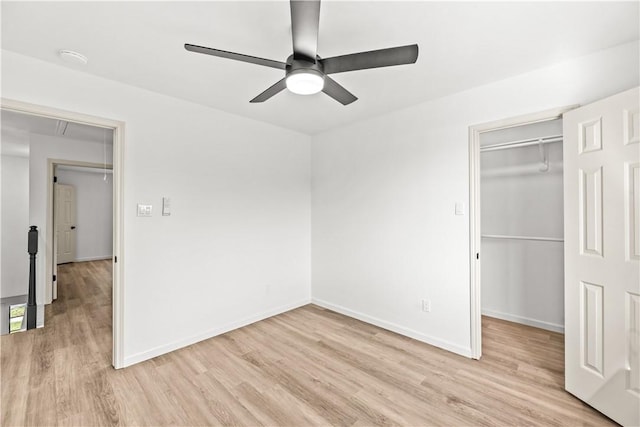 5025 Queens Ct, Corpus Christi, TX 78413 - unfurnished bedroom featuring light wood-type flooring, a closet, a spacious closet, and a ceiling fan