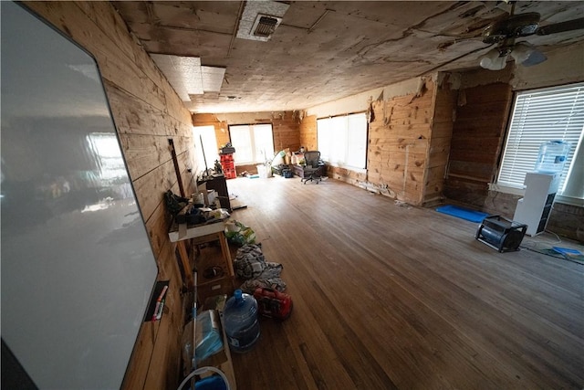 misc room with ceiling fan and wood-type flooring