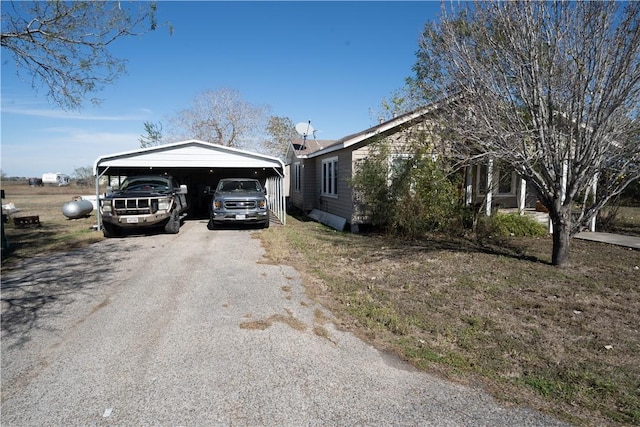 view of front facade with a carport