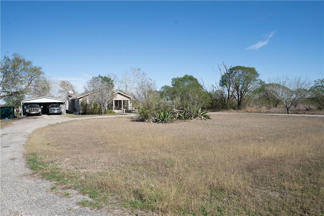 view of front of property featuring a carport