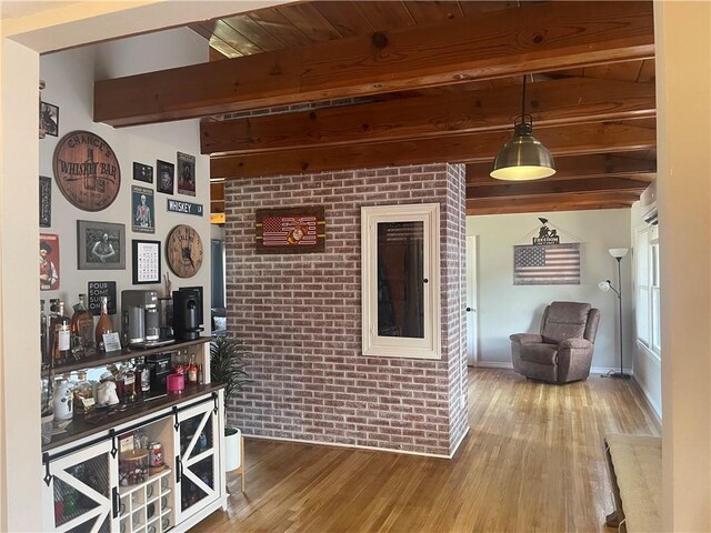 721 S 8th St, Kingsville, TX 78363 - bar area featuring beamed ceiling, wood finished floors, and brick wall