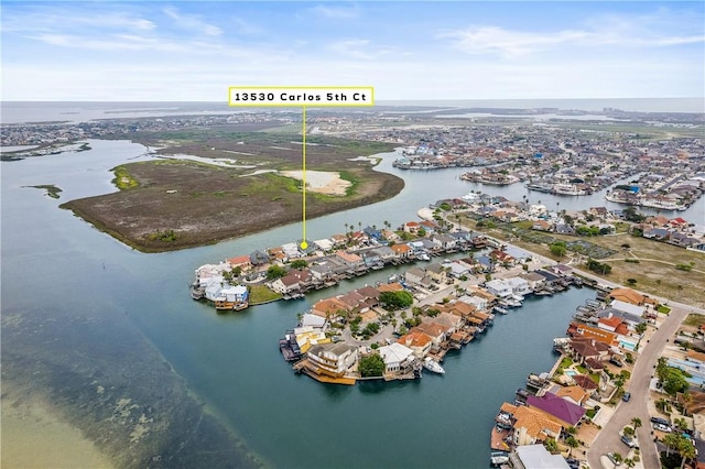 drone / aerial view featuring a water view and a residential view